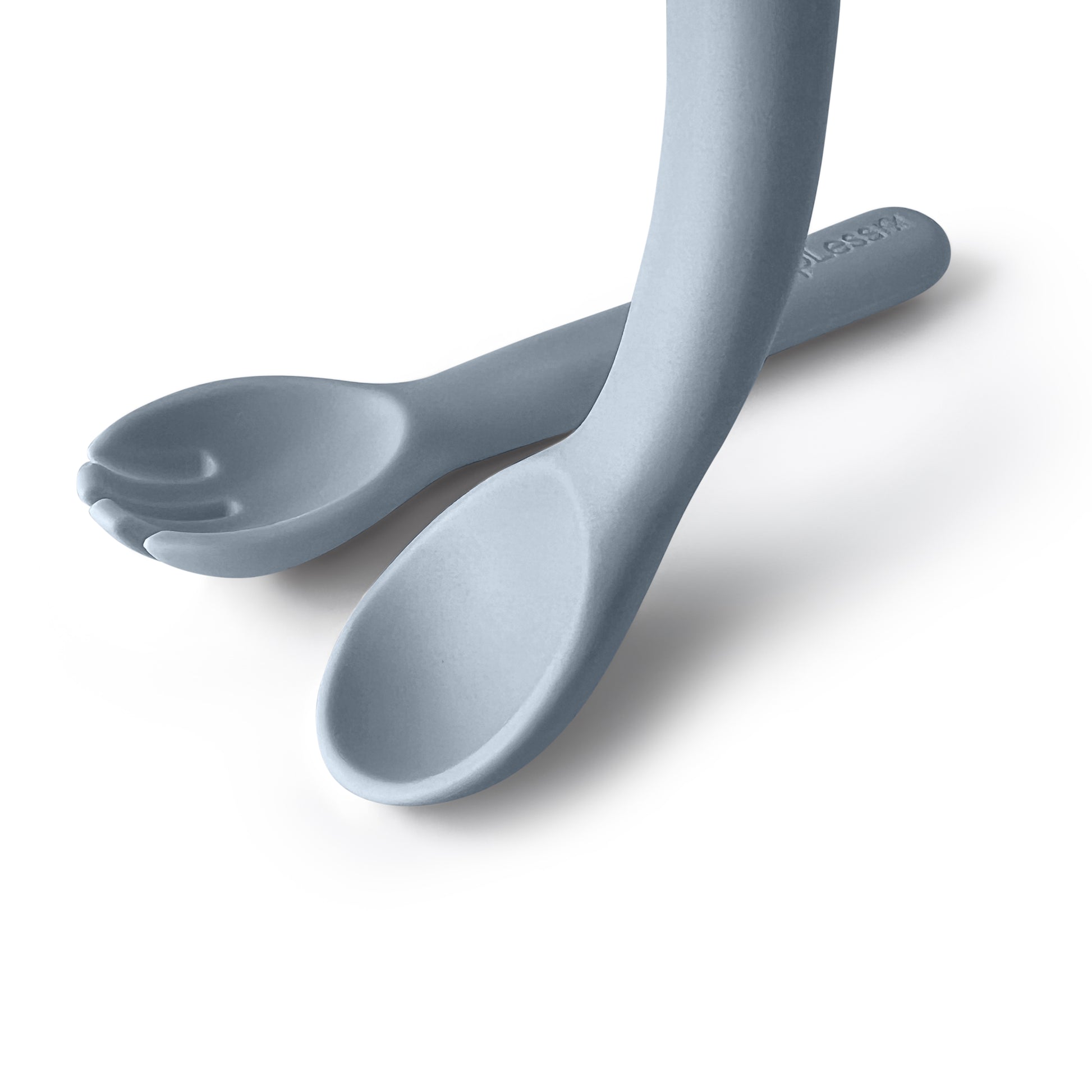 Two blue spoons on a white background