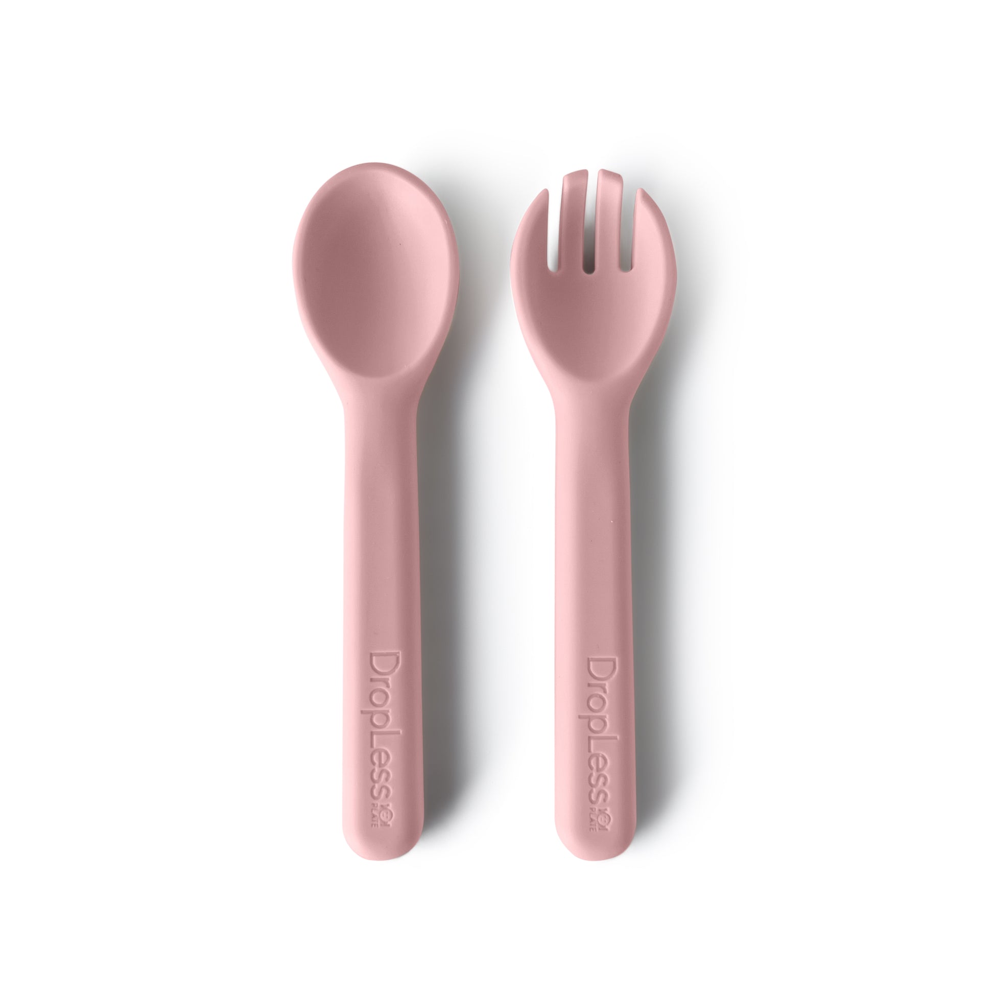 Pink spoon and fork set on a white background