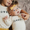 Load image into Gallery viewer, Baby Loved Long Sleeve Bodysuit. Made in USA from 100% GOTS certified organic cotton.